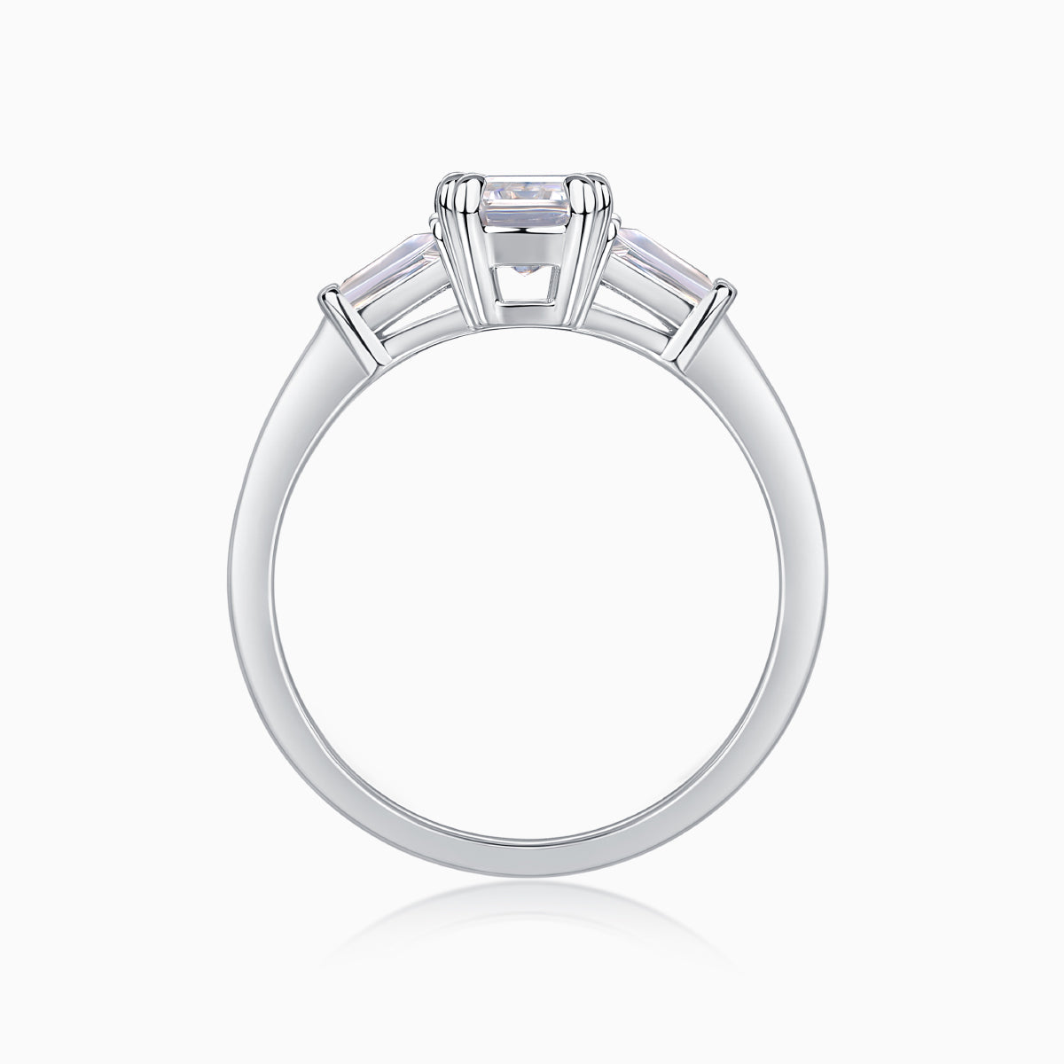 White gold vermeil ring with emerald-cut moissanite center stone and side stone settings
