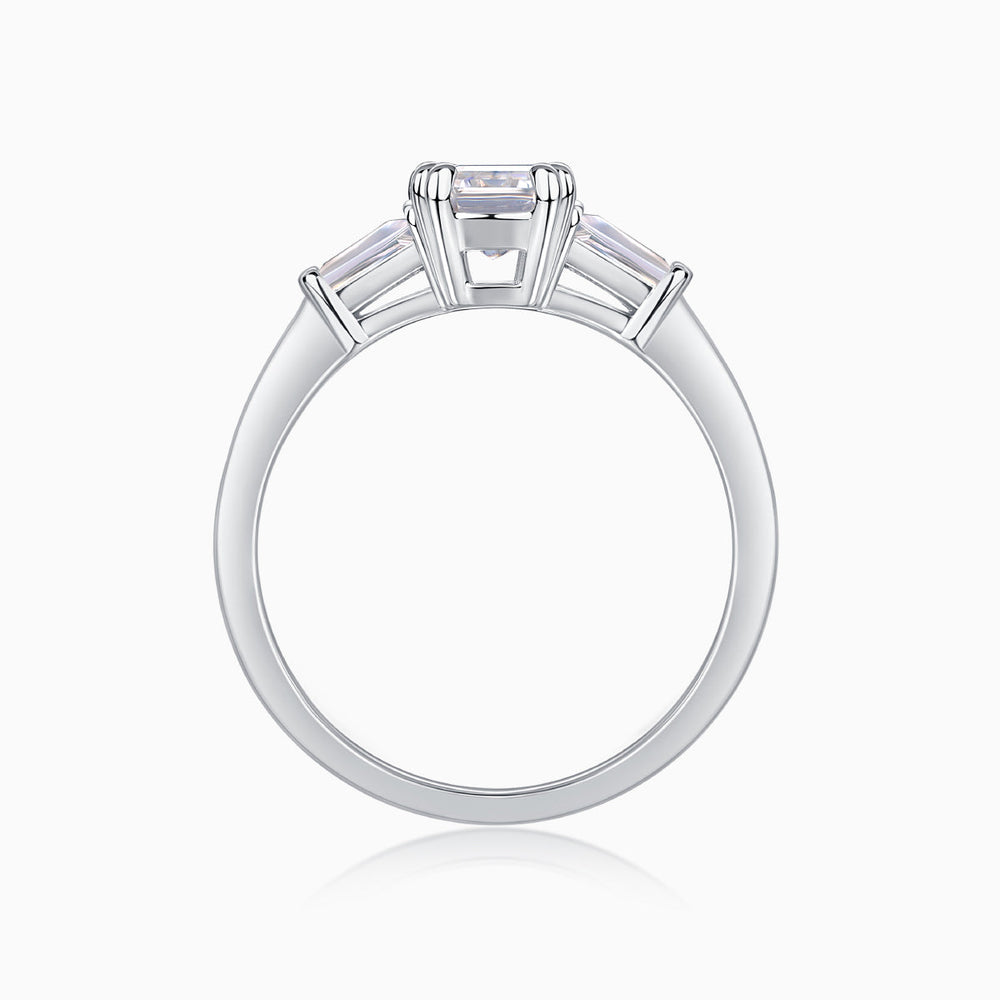 White gold vermeil ring with emerald-cut moissanite center stone and side stone settings