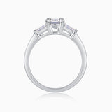 White gold vermeil ring with emerald-cut moissanite center stone and side stone settings