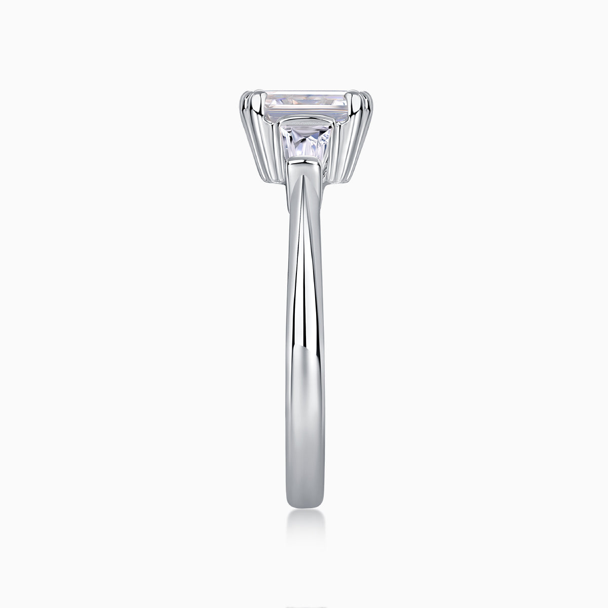Emerald-cut moissanite three-stone engagement ring, white gold vermeil, upright center view