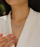 Cuban link chain necklace with square princess-cut moissanite pendant on the neckline