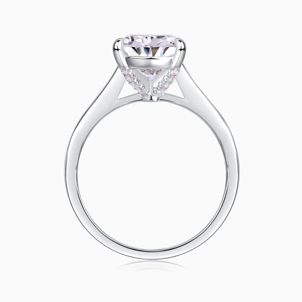 White gold vermeil pear-cut solitaire moissanite ring, angled view of prongs and gallery