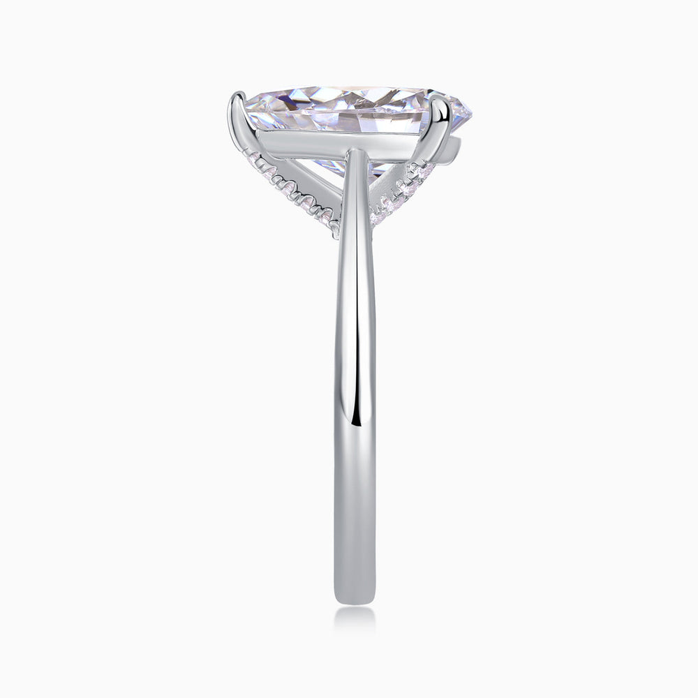 White gold vermeil pear-cut solitaire moissanite ring with side prongs and cathedral setting