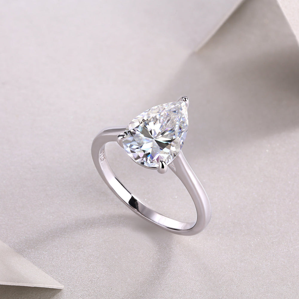 White gold vermeil pear-cut solitaire moissanite ring, close view of center stone