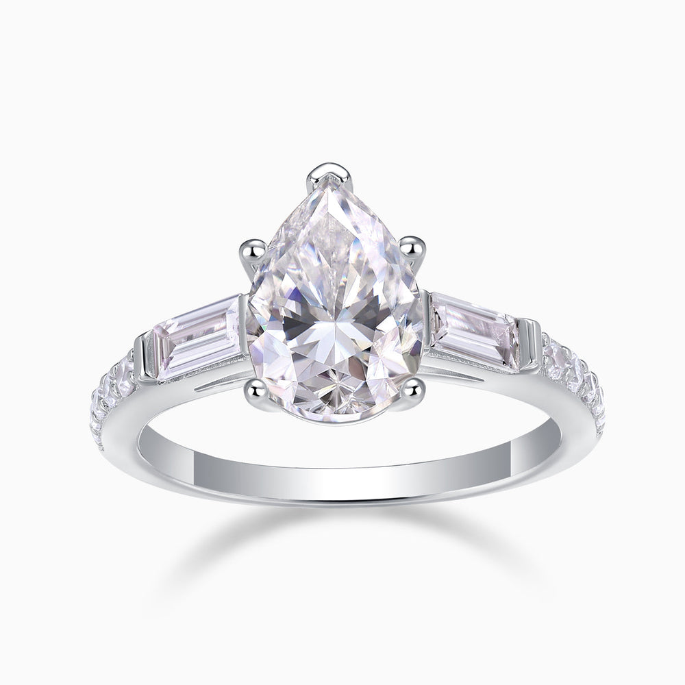 Pear-cut moissanite with baguette side stones and pavé band, white gold ring profile