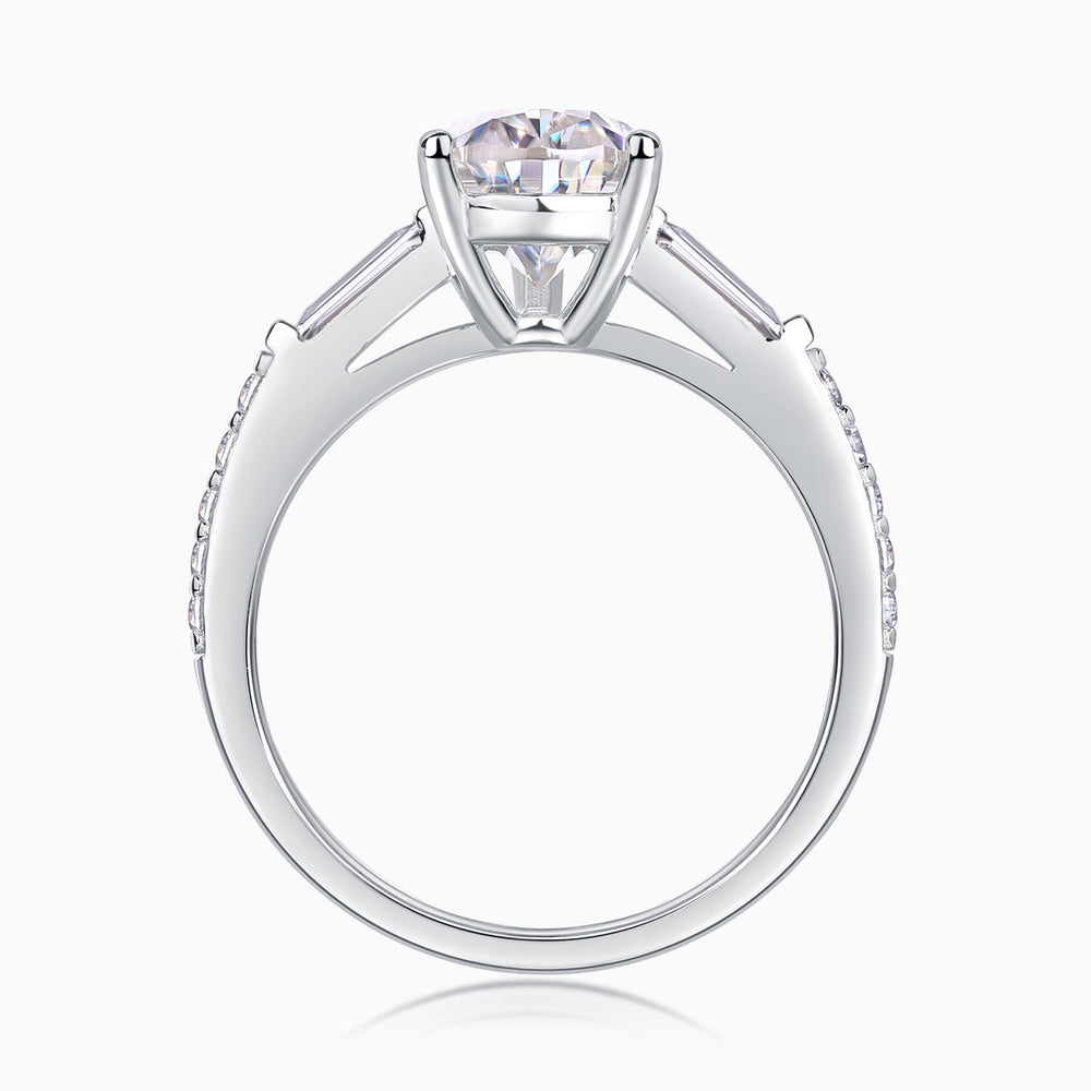 Profile view of pear-cut moissanite setting with baguette shoulders and pavé band