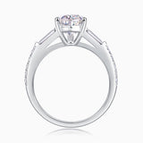Profile view of pear-cut moissanite setting with baguette shoulders and pavé band