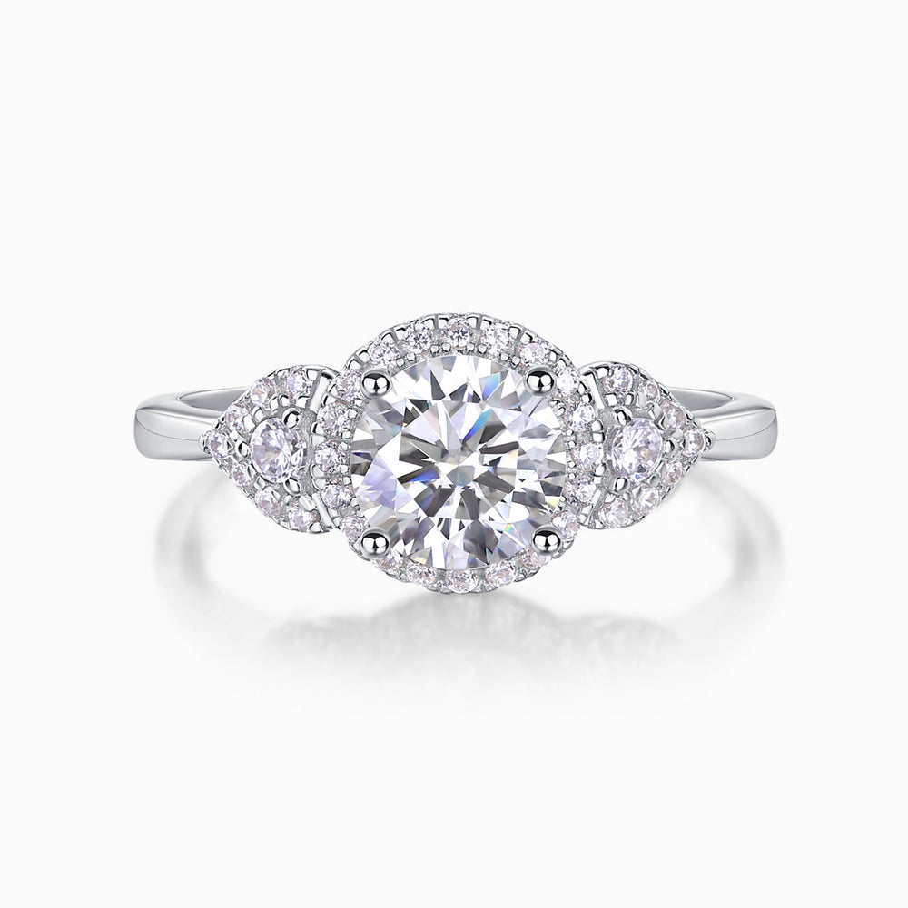 Round moissanite halo ring with prong-set center and pavé border on sleek band