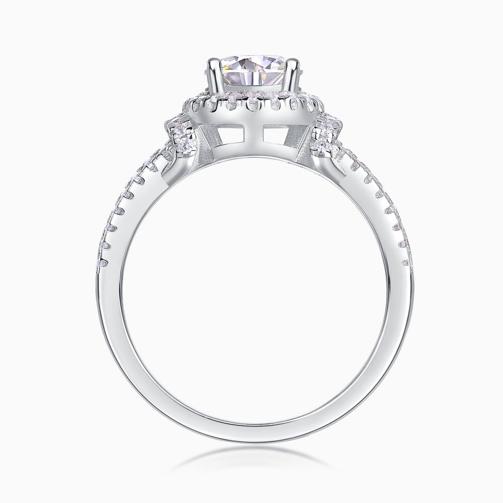 Halo engagement ring view from side, square prongs and pavé band around the shank