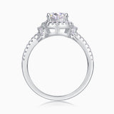 Halo engagement ring view from side, square prongs and pavé band around the shank