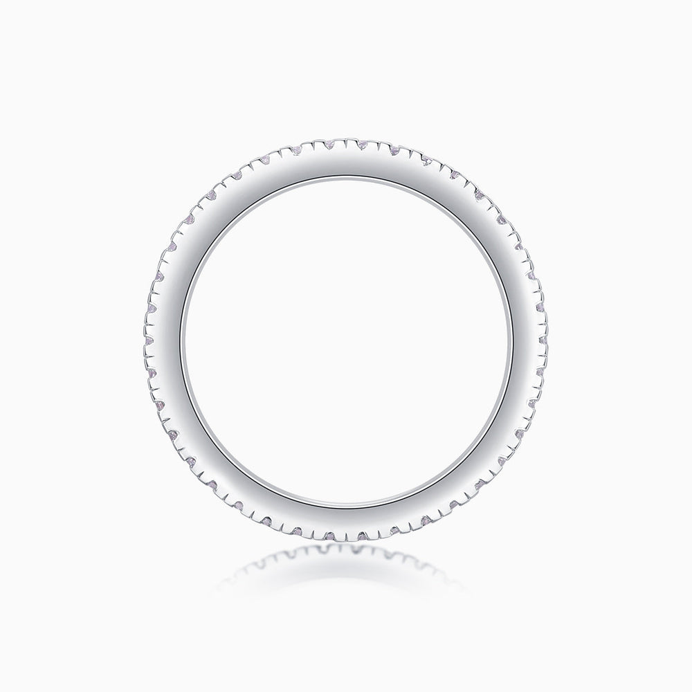 Moissanite eternity band top view with scalloped pave edge and smooth inner band