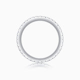 Moissanite eternity band top view with scalloped pave edge and smooth inner band