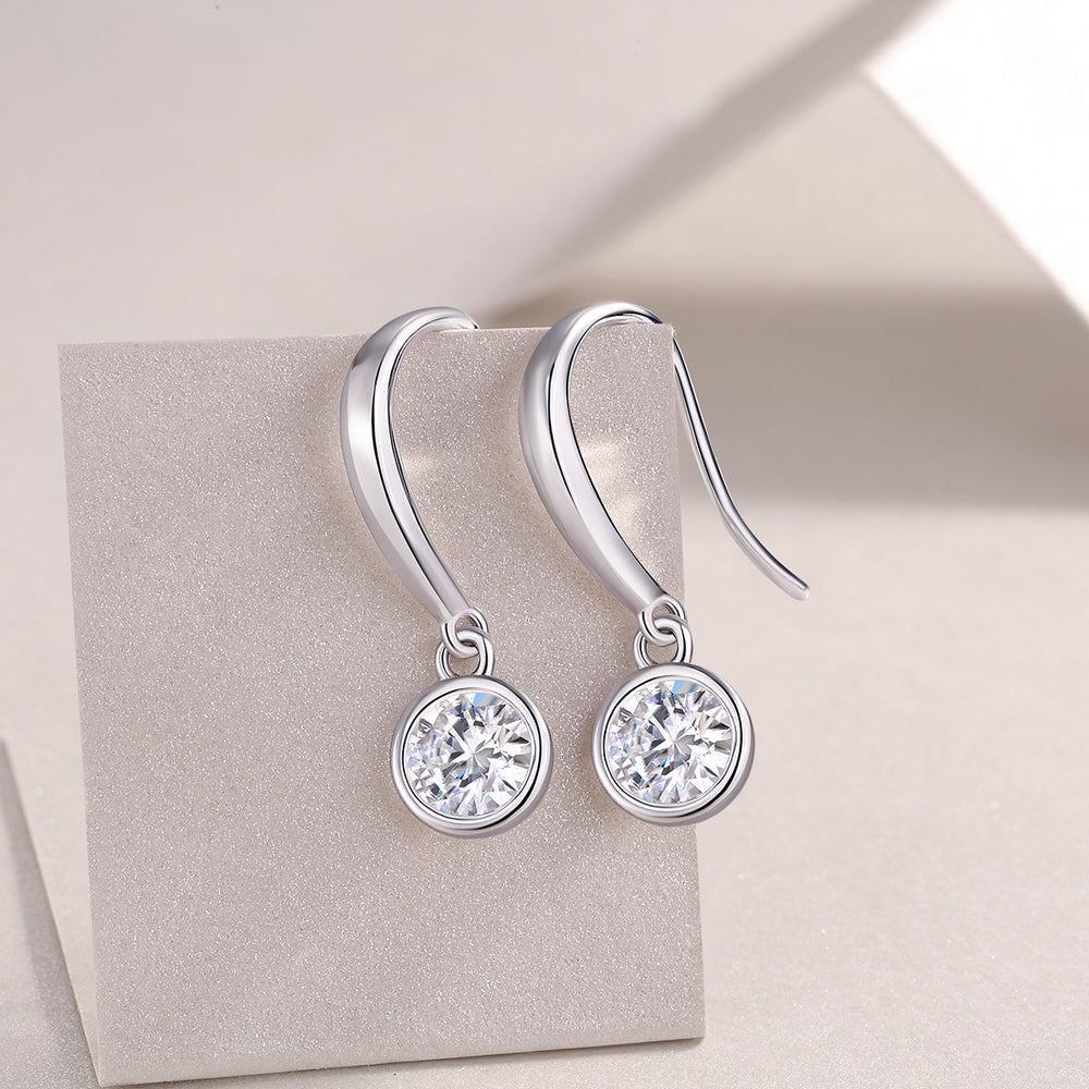 Round moissanite drop earrings, bezel-set stones with small loop details