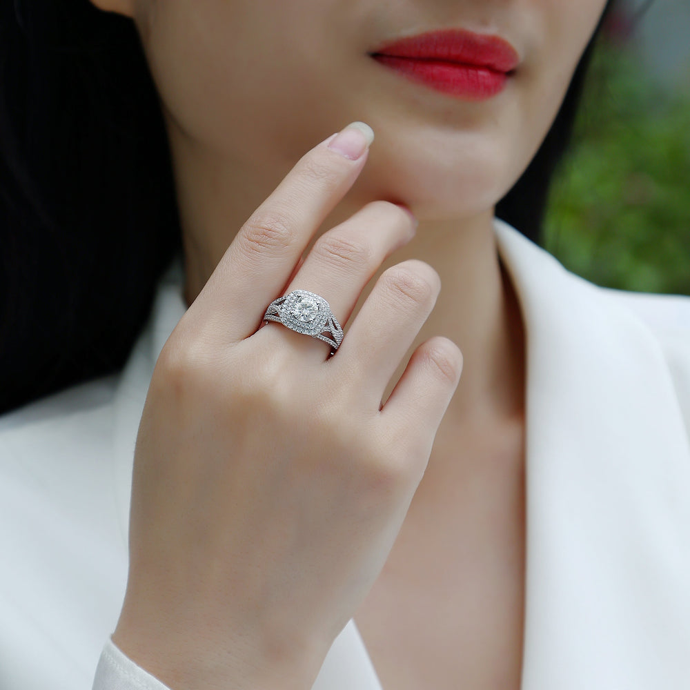 Moissanite cushion halo ring on hand, white gold-plated band with sparkle