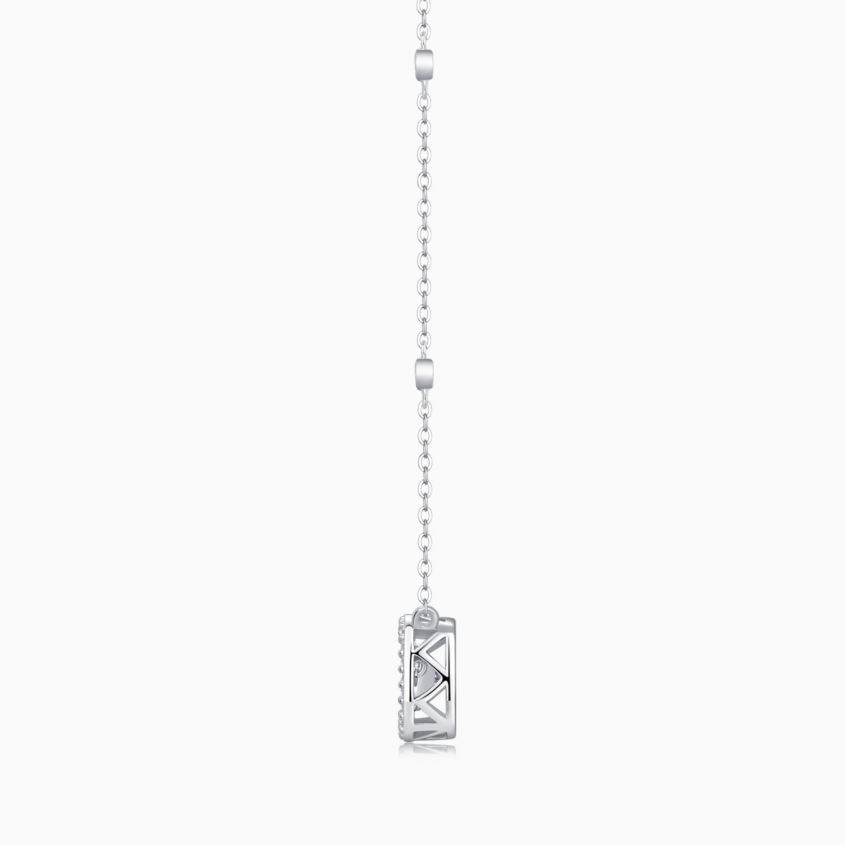 Cushion halo moissanite pendant side view on station chain, white gold vermeil