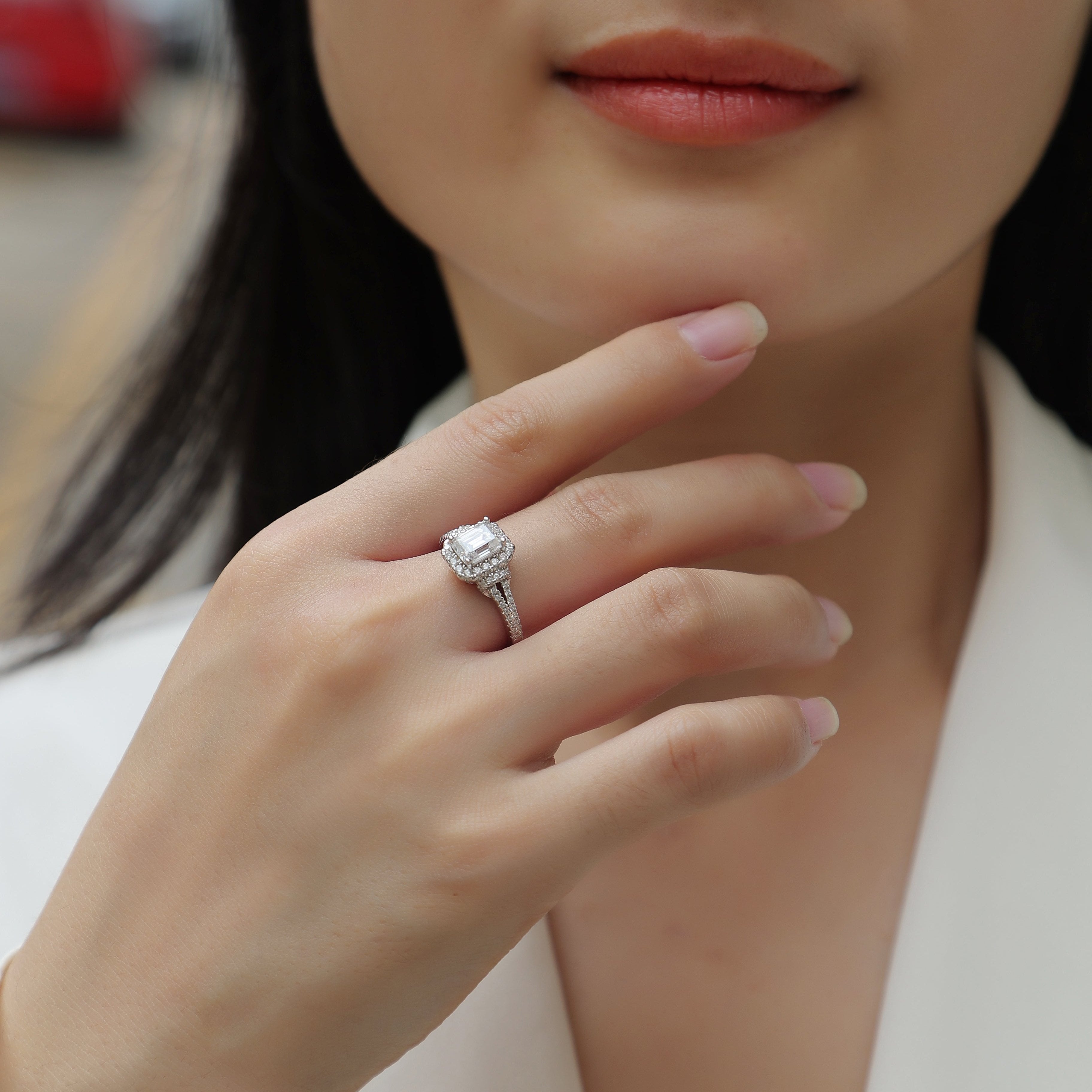 Emerald-cut halo ring on hand, double pavé split shank, white gold vermeil