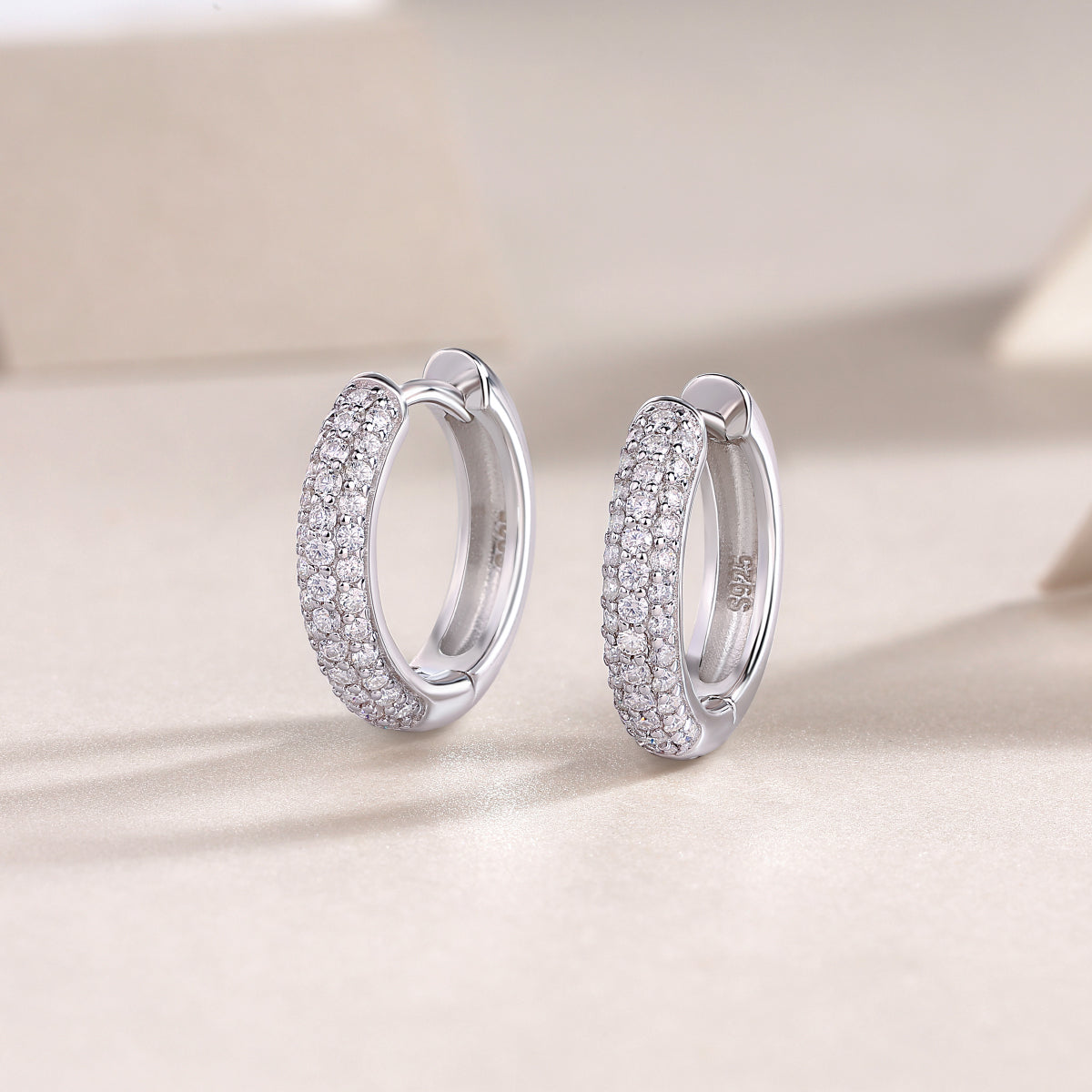 Triple row pavé moissanite huggie hoops, front view—white gold vermeil