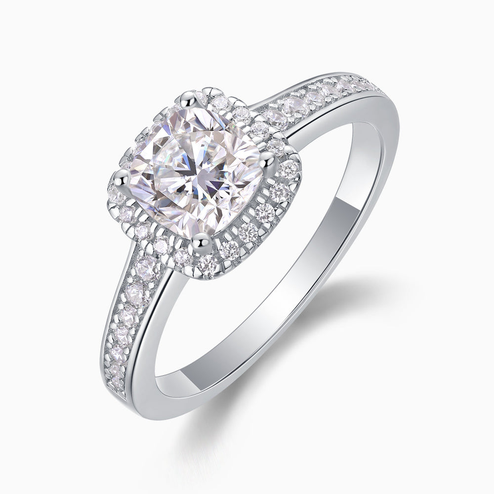 Angled view of cushion halo pavé moissanite engagement ring, bezel halo and pavé sides