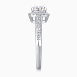 Front view of cushion-cut moissanite in halo, pavé-set band and prongs