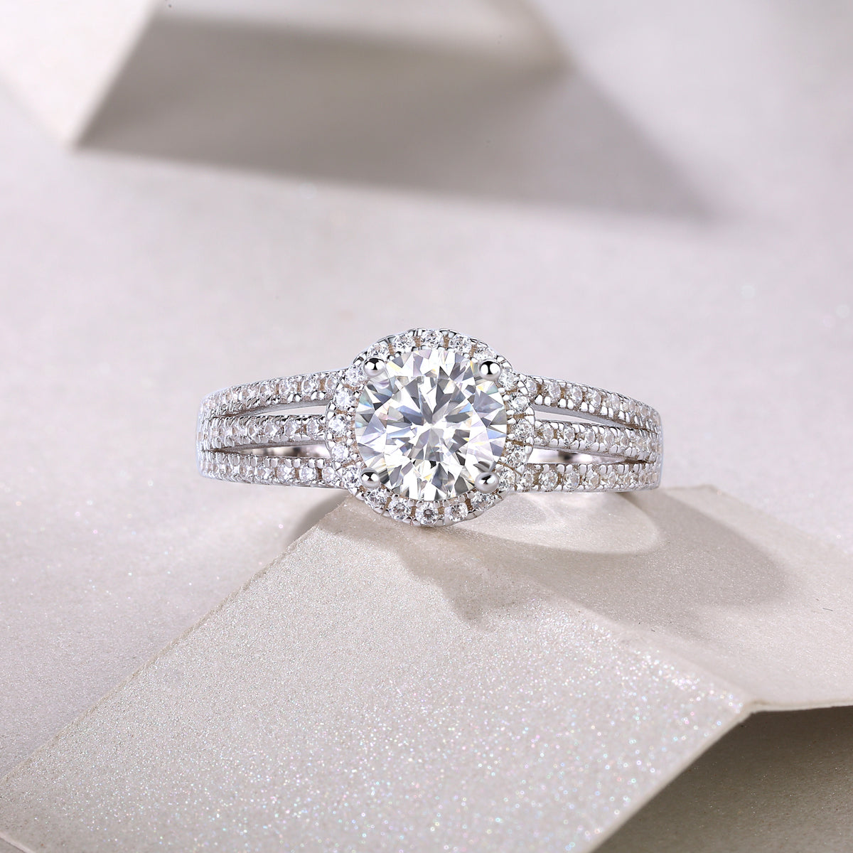 Round halo moissanite ring with pavé bands and split shank, white gold vermeil