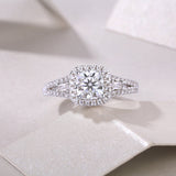 Cushion cut halo moissanite ring with baguette accents and pavé details, white gold