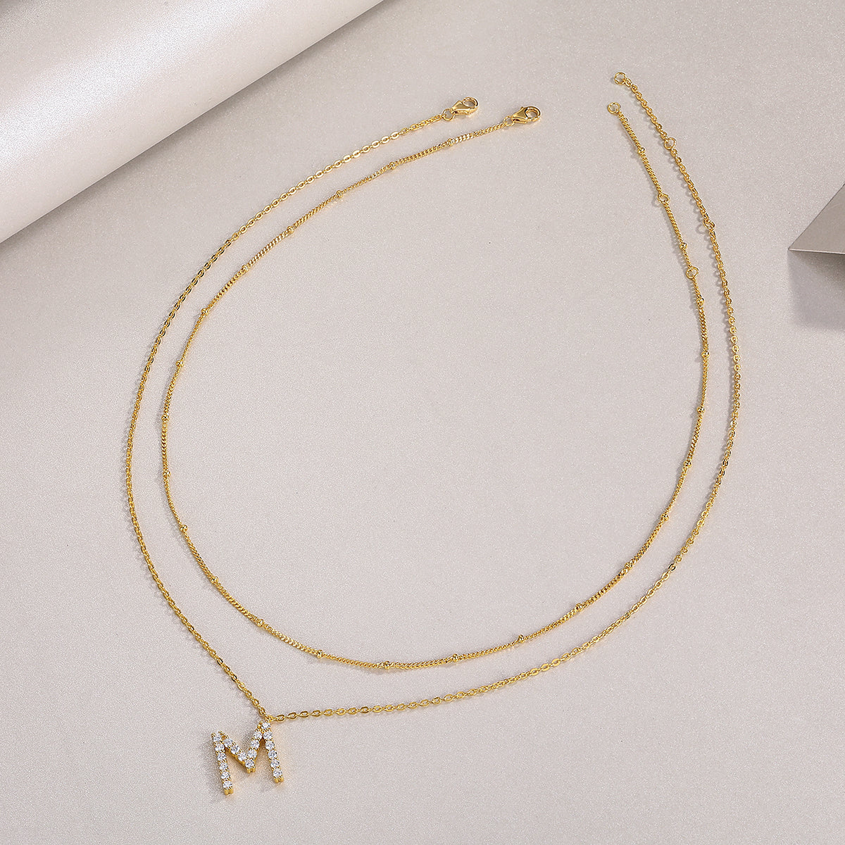 Initial M double-chain necklace, yellow gold vermeil with rhinestone M pendant