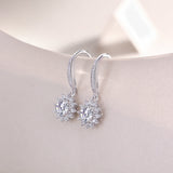 Sunflower halo drop earrings, dangling floral halos with round moissanite center