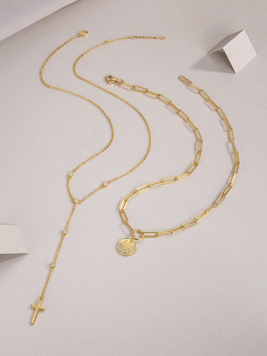 Layered lariat necklace set with coin medallion and dangling cross, blue stones