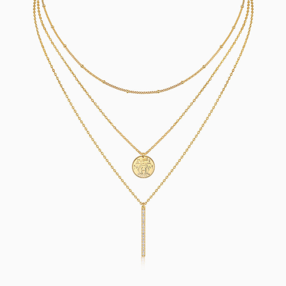 Layered coin-and-bar necklace set, yellow gold vermeil tone, three chains