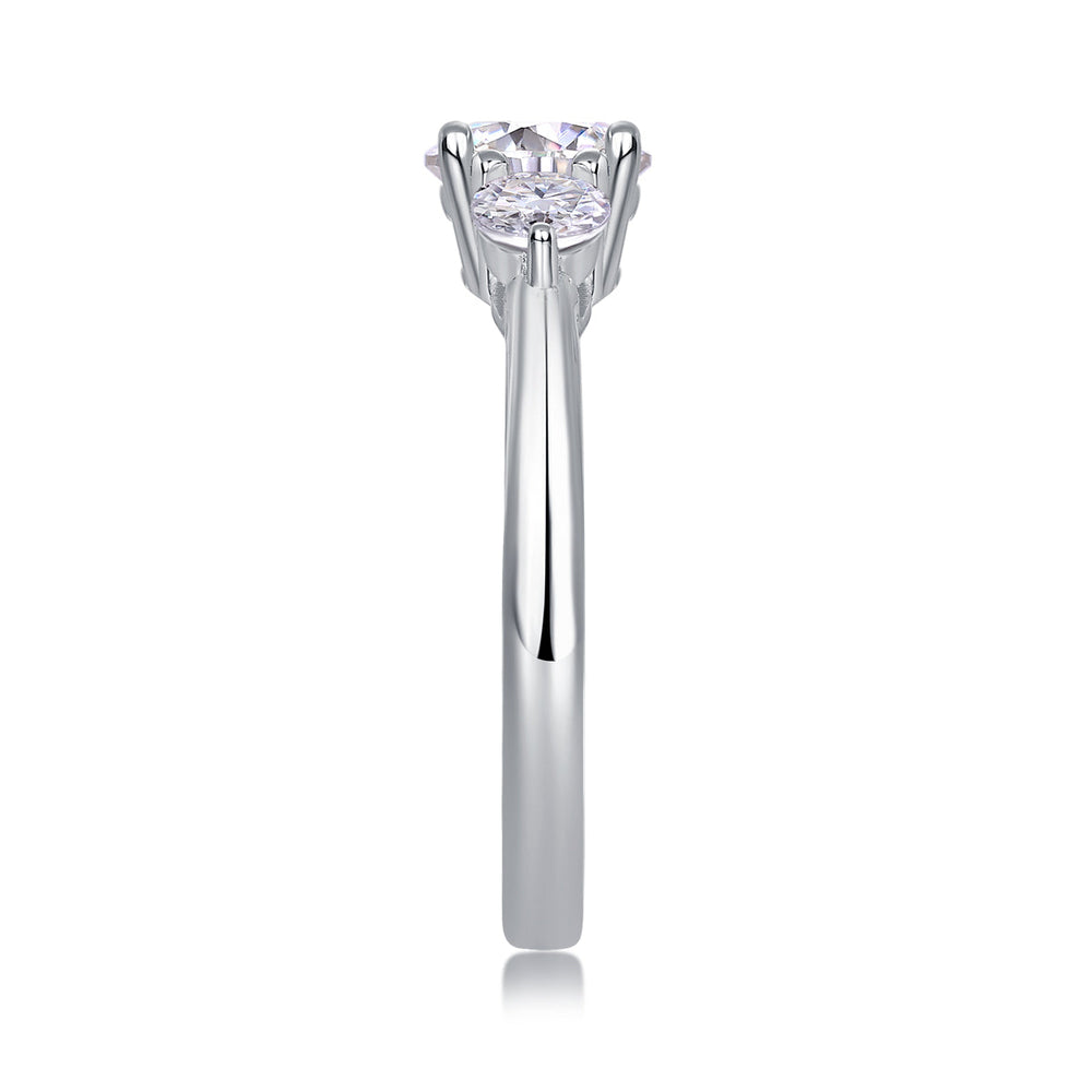 Close-up of round center moissanite with prongs on a white gold vermeil band