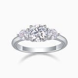 Three-stone round moissanite engagement ring in white gold vermeil with center and side stones