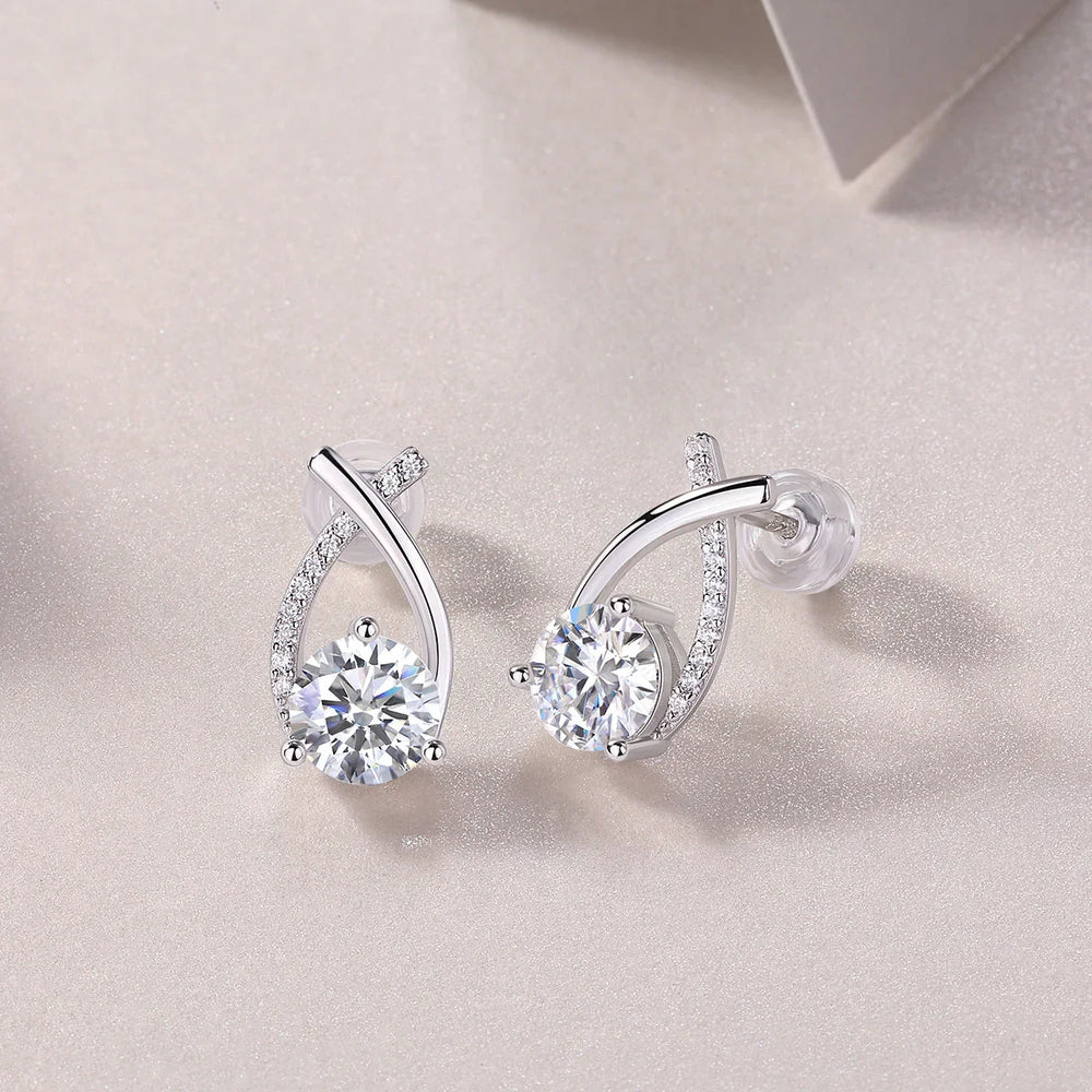 Teardrop moissanite stud earrings with curved ribbon pavé and round center stones