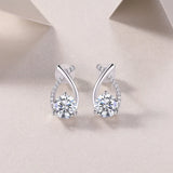Teardrop ribbon pavé moissanite studs with bezel-set center stone and push-back