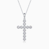 White gold cross pendant with round moissanite stones on link chain