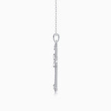 White gold tone cross pendant back view with bail and chain links, pavé details