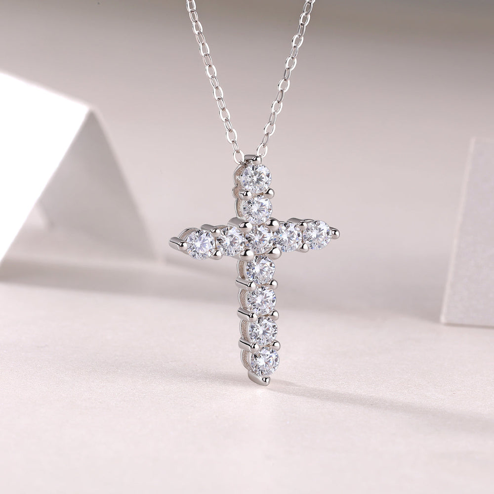 White metal cross pendant with multiple bezel-set round moissanite stones