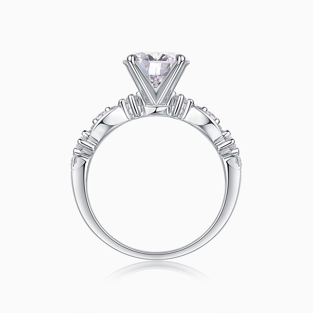 Round twist moissanite engagement ring top view, round center stone with pavé shoulders