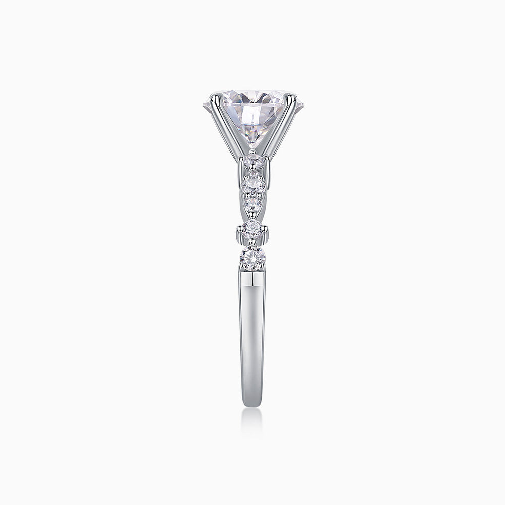 Round twist moissanite engagement ring side profile, prong-set center with stacked side stones