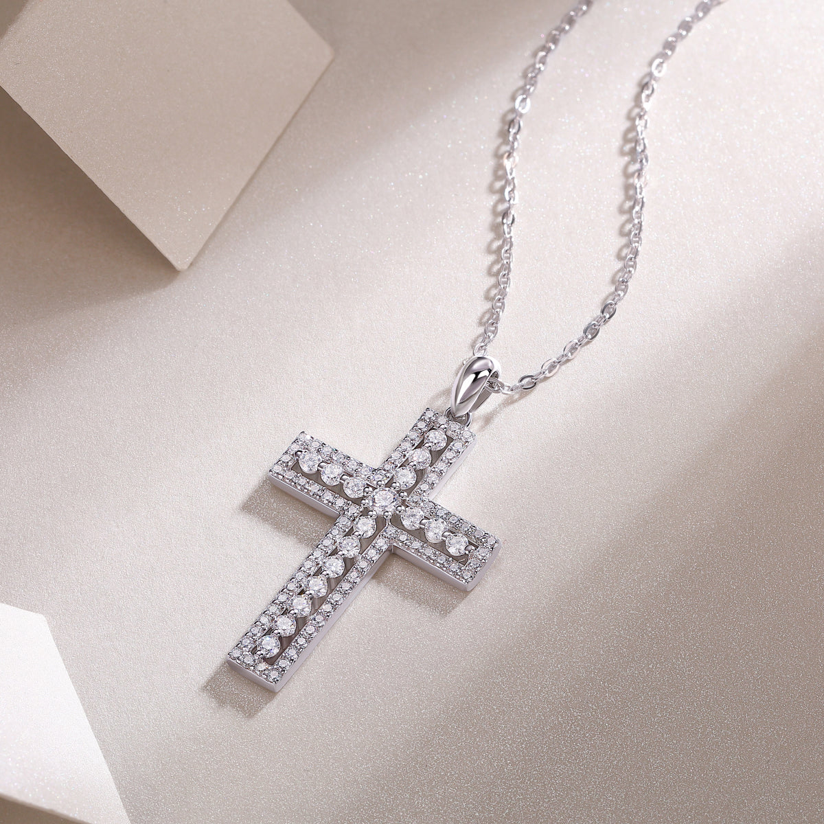 White gold vermeil pavé cross pendant with detailed stone pattern and bail top