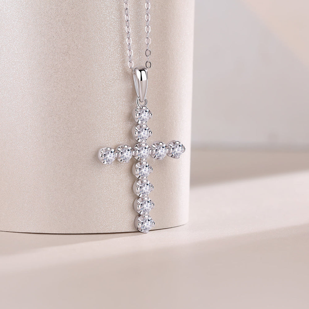 Cross pendant with round stones in a cluster, teardrop bail on link chain