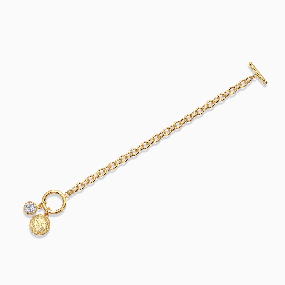 Yellow gold vermeil chain bracelet with toggle bar, coin charm, and round moissanite