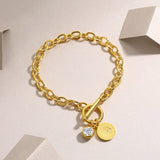 6.5-inch yellow gold vermeil chain bracelet with toggle clasp and coin charm