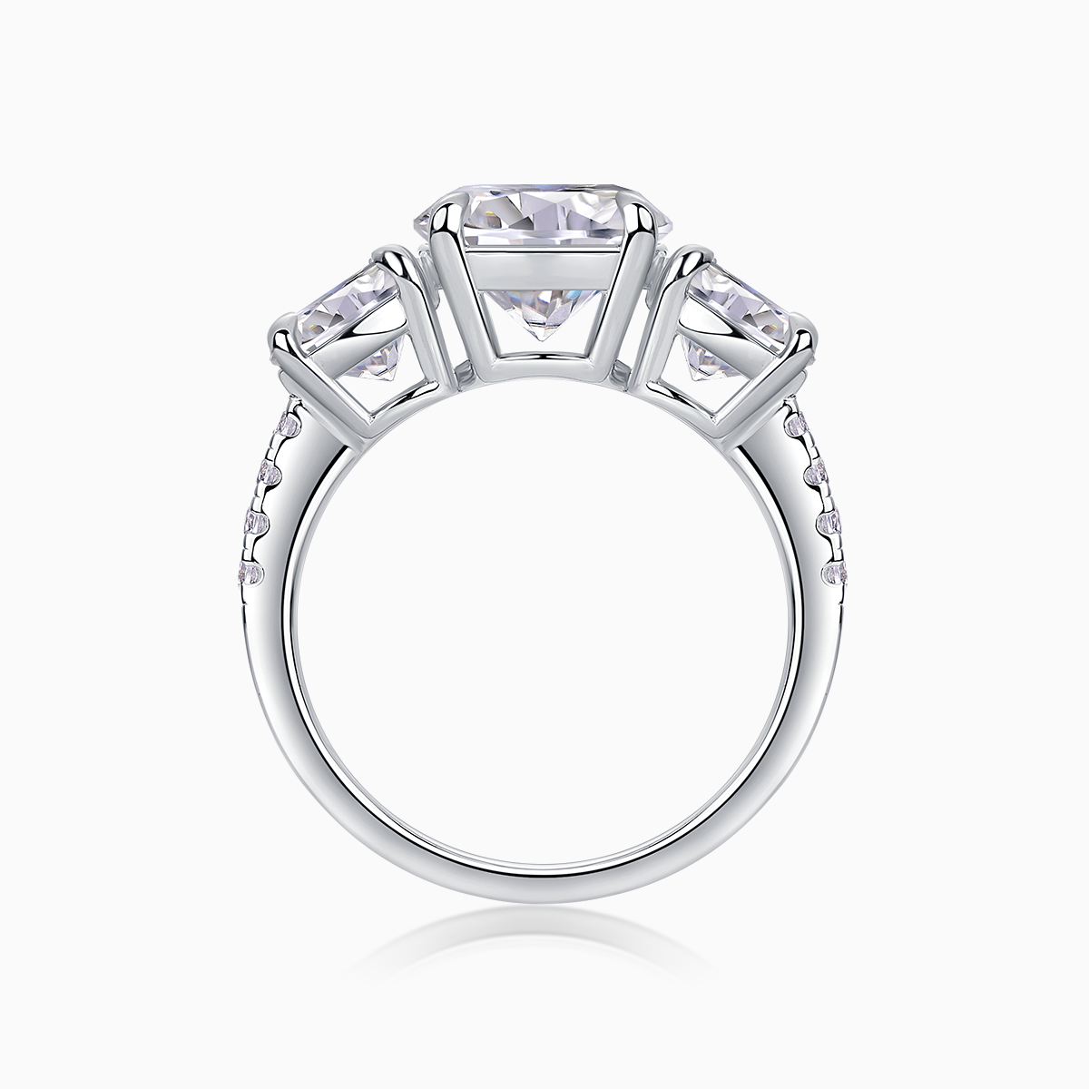 Three-round moissanite engagement ring top view with prong-set stones