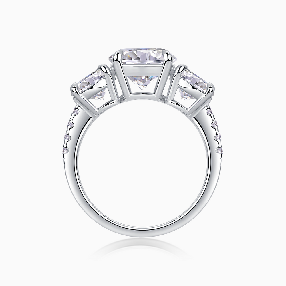 Three-round moissanite engagement ring top view with prong-set stones
