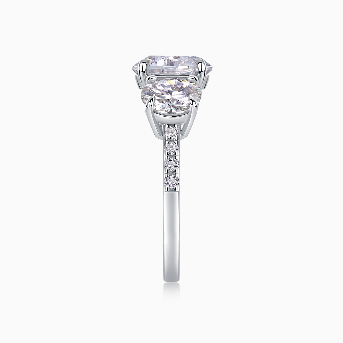 Three-round moissanite engagement ring with prongs and pavé-style band detail