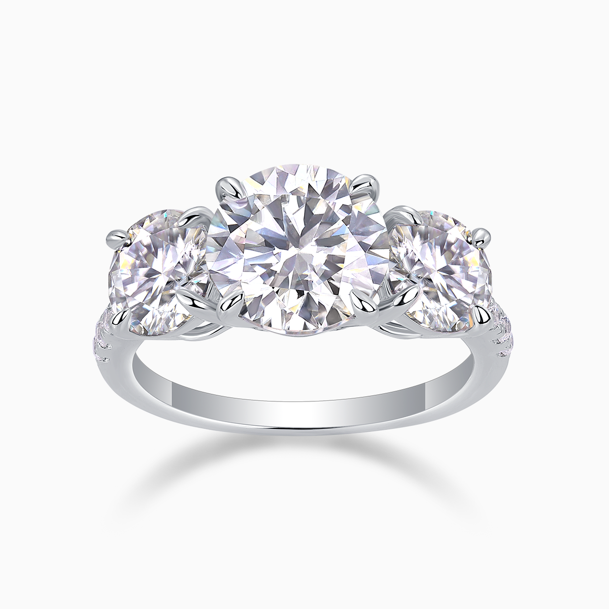 Three-round moissanite engagement ring with three round stones and white gold-plated band