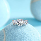 Three-round moissanite engagement ring with three round stones, close-up