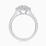 Top view of halo moissanite engagement ring, prong-set center stone, white gold vermeil