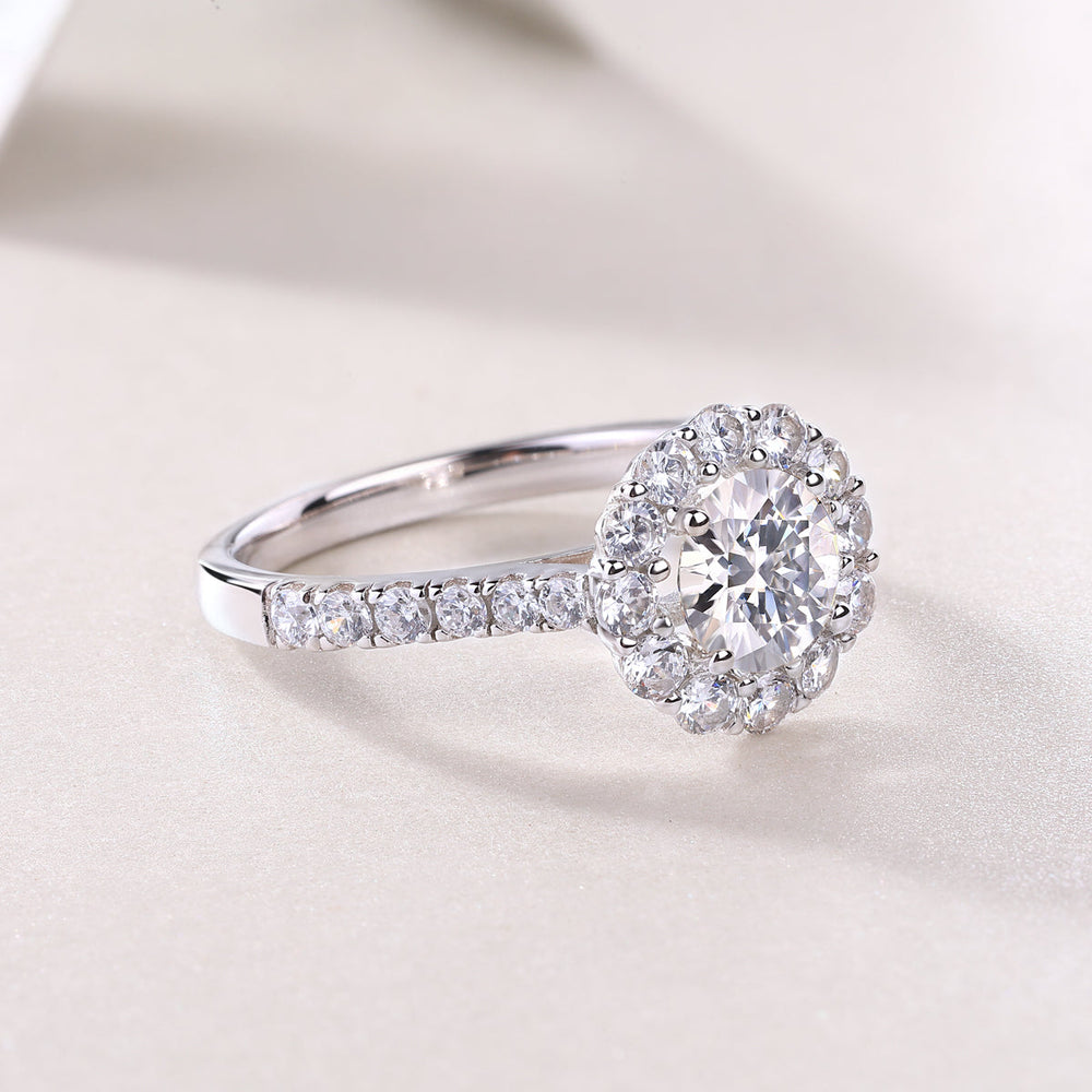 Halo moissanite ring with pavé band and round center stone, white gold vermeil