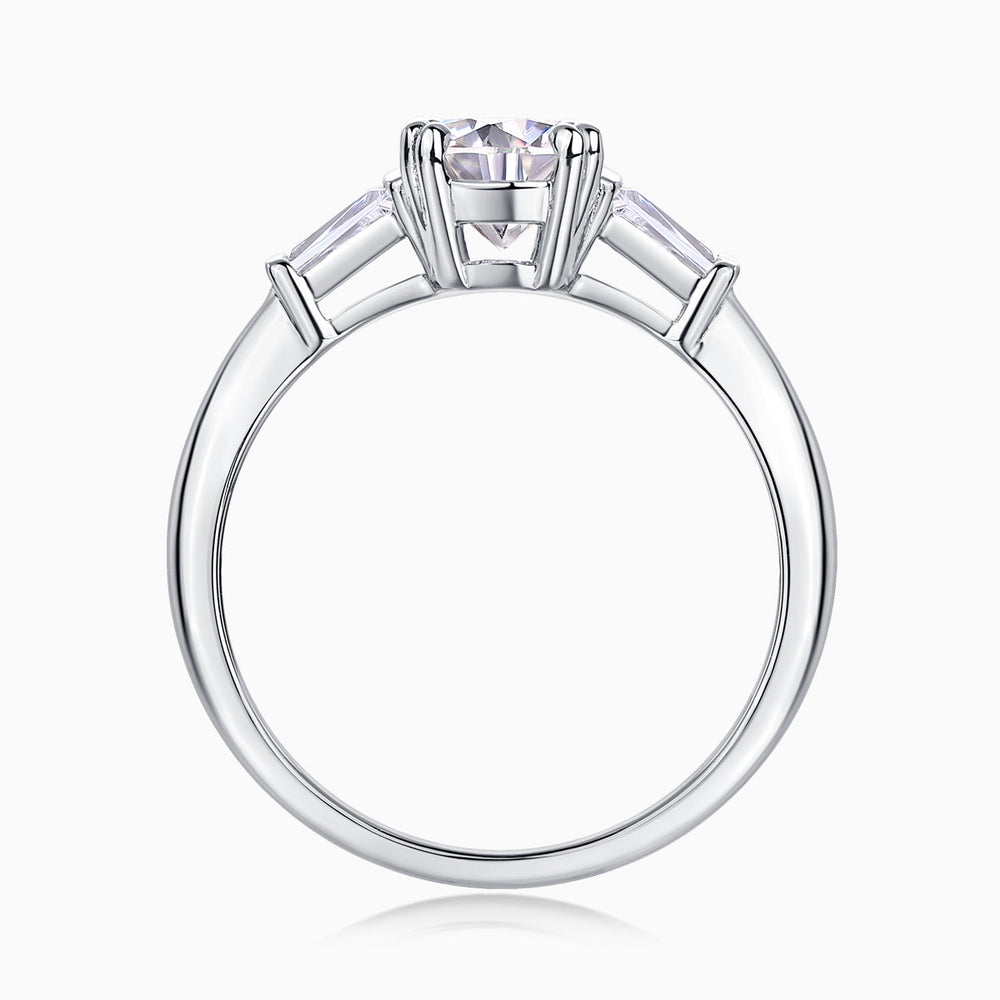 White metal ring top view with round moissanite center in prong setting